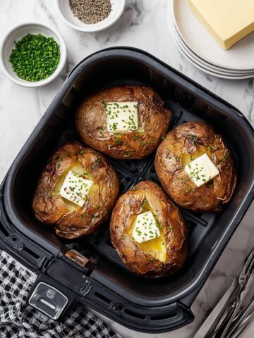 Air Fryer Baked Potatoes with Butter and Black Pepper Recipe