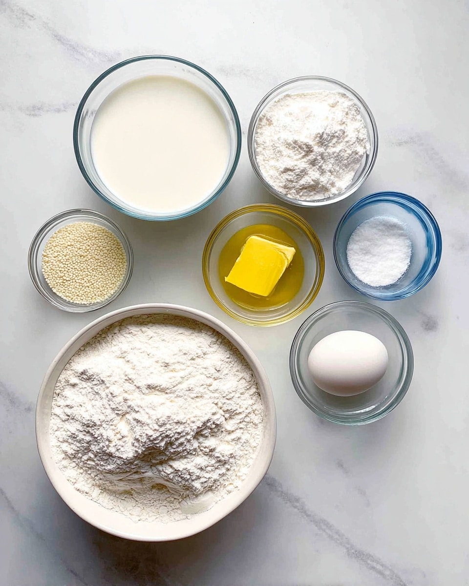 Seven small clear glass bowls are arranged on a white marbled background. Starting from the bottom right, a large white bowl is filled with white flour, next to it on the left a medium bowl with white milk. Above the milk is a small bowl with melted butter, and above that a medium bowl filled with powdered sugar. At the top right, there is a small bowl with a single raw egg, below it a tiny bowl with some salt, and to the top left, a tiny bowl filled with dry yeast granules. All bowls are clear glass except the large white bowl holding the flour photo taken with an iphone --ar 4:5 --v 7