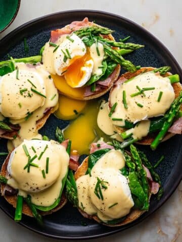 Eggs Benedict for a Crowd: Poached Eggs, Canadian Bacon, and Hollandaise on Toasted English Muffins Recipe