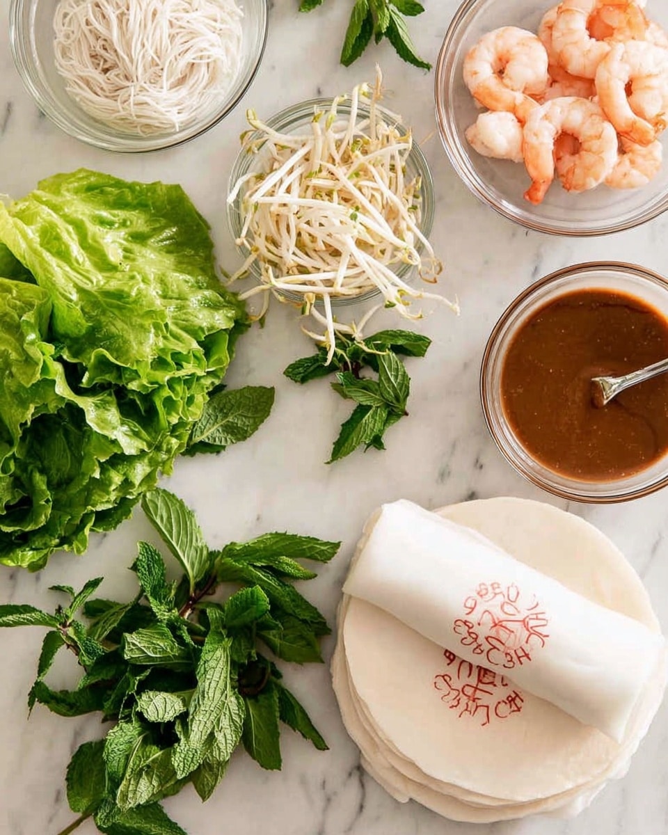The image shows fresh ingredients arranged on a white marbled surface for making spring rolls. On the right, there is a stack of three white rice paper wrappers with red and green writing on top. Above them are two small glass bowls; one filled with thin white noodles and the other with pink shrimp. To the left of these bowls is a cluster of fresh green lettuce leaves, topped with a small pile of white bean sprouts. Below the lettuce is a bunch of fresh green mint leaves. At the top right, there is a clear bowl with a brown sauce and a spoon inside. The colors are fresh and vibrant with different shades of green, white, pink, and brown. Photo taken with an iphone --ar 4:5 --v 7