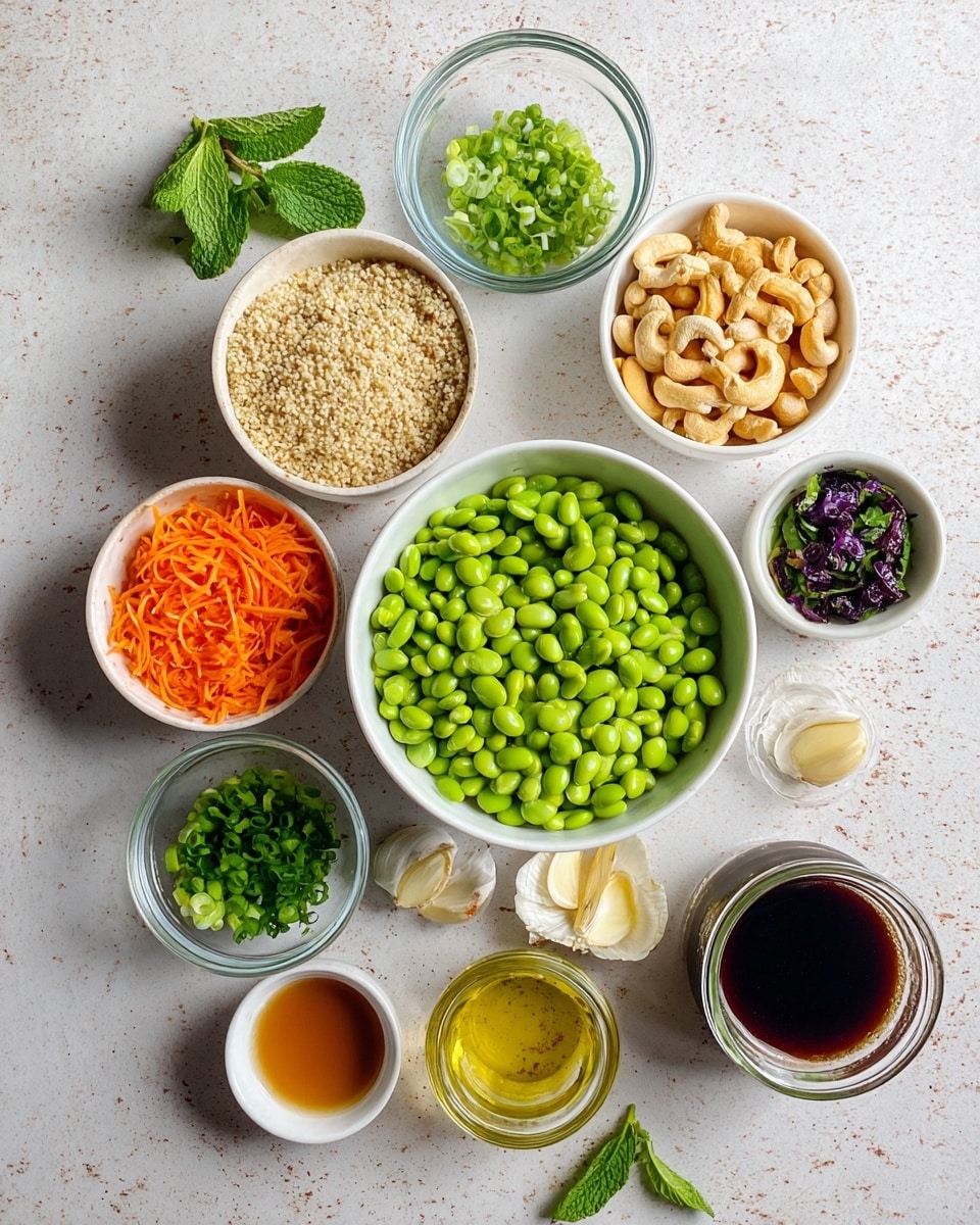 The image shows a top view of various small white bowls and clear glass containers arranged on a white marbled surface. The largest bowl in the center holds a large amount of green soybeans. Surrounding it are smaller bowls containing bright orange shredded carrots, light beige quinoa, dark roasted cashew nuts, chopped green onions, freshly chopped mint leaves, freshly chopped cilantro, dark soy sauce, yellow ginger slices, two garlic cloves on a white saucer, light yellow sesame oil, amber-colored liquid in a small bowl, a thick brown sauce, and a small jar of white liquid. A few fresh mint leaves are placed directly on the surface near the garlic. All items are neatly arranged and brightly lit, giving a fresh and clean look. photo taken with an iphone --ar 4:5 --v 7