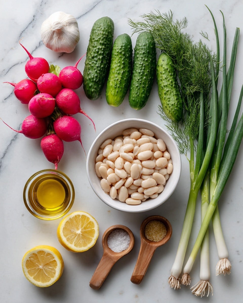 The image shows fresh ingredients neatly placed on a white marbled surface. In the center, there is a white bowl full of white beans, creamy and smooth in texture. Around it, five radishes in red, pink, and white colors are positioned on the left side, above them two green cucumbers sit vertically. Above the bowl, there is a bunch of bright green dill with fine leaves, and beside it is a single garlic clove. At the bottom left are two lemon halves with vibrant yellow skin and juicy interiors. Below the lemons is a small glass container filled with golden olive oil. To the right of the olive oil, two small wooden measuring spoons hold fine salt and pale Dijon mustard. At the bottom right corner, three long green onions with white bulbs lie horizontally. The whole setup is clean and bright. Photo taken with an iphone --ar 4:5 --v 7