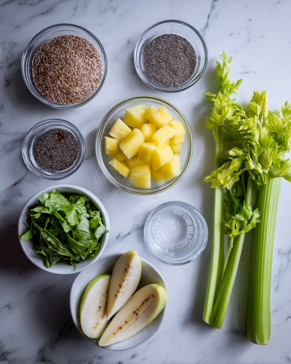 The image shows several small clear glass bowls and a white bowl arranged neatly on a white marbled surface. The bowls contain different ingredients: one has light brown flax seeds, another has dark chia seeds, a third holds yellow pineapple chunks, and another is filled with small pieces of green apple. There is also a bowl with two frozen banana pieces, a white bowl with mixed fresh green leafy vegetables, and a glass measuring cup with red coconut water. To the right side, three fresh green celery stalks with leaves are placed directly on the marble surface. The ingredients are spaced out clearly, showing their colors and textures against the clean white marble background. Photo taken with an iphone --ar 4:5 --v 7